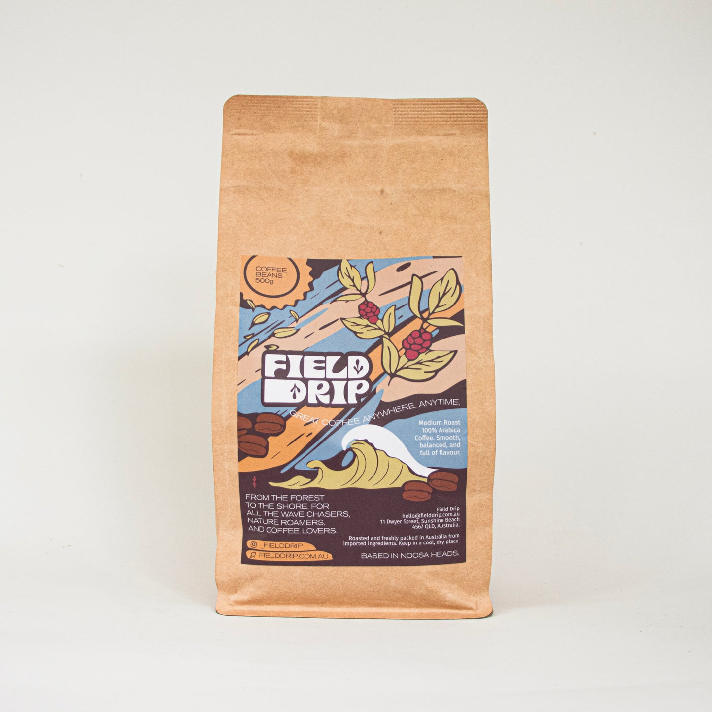 500g Field Drip coffee beans in a kraft paper bag on a beige background, studio product shot.
