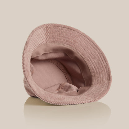 Inside view of the Field Drip hazy-pink corduroy bucket hat showing soft lining and stitching.
