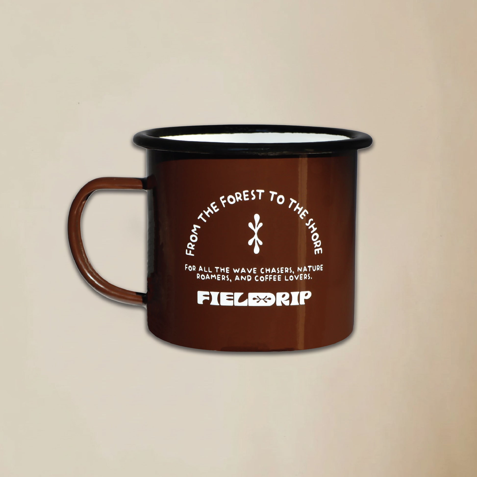Field Drip enamel camping mug in walnut dark brown with white logo on a beige background.