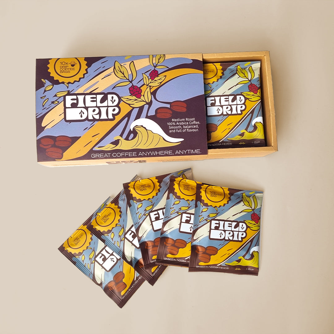 Field Drip open box of drip coffee sachets with packets fanned out on table.